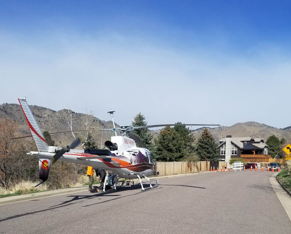 Helicopter sits on the ground in Golden.